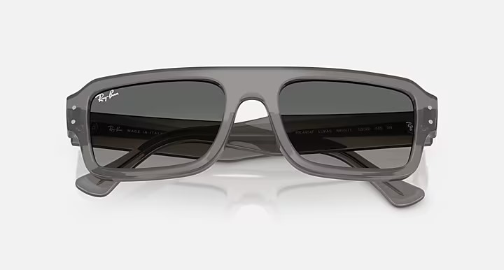 عینک آفتابی ری‌بن مدل RB4454F 6805/71 FLACKO BIO-BASED فریم شفاف خاکستری و عدسی گرادینت خاکستری